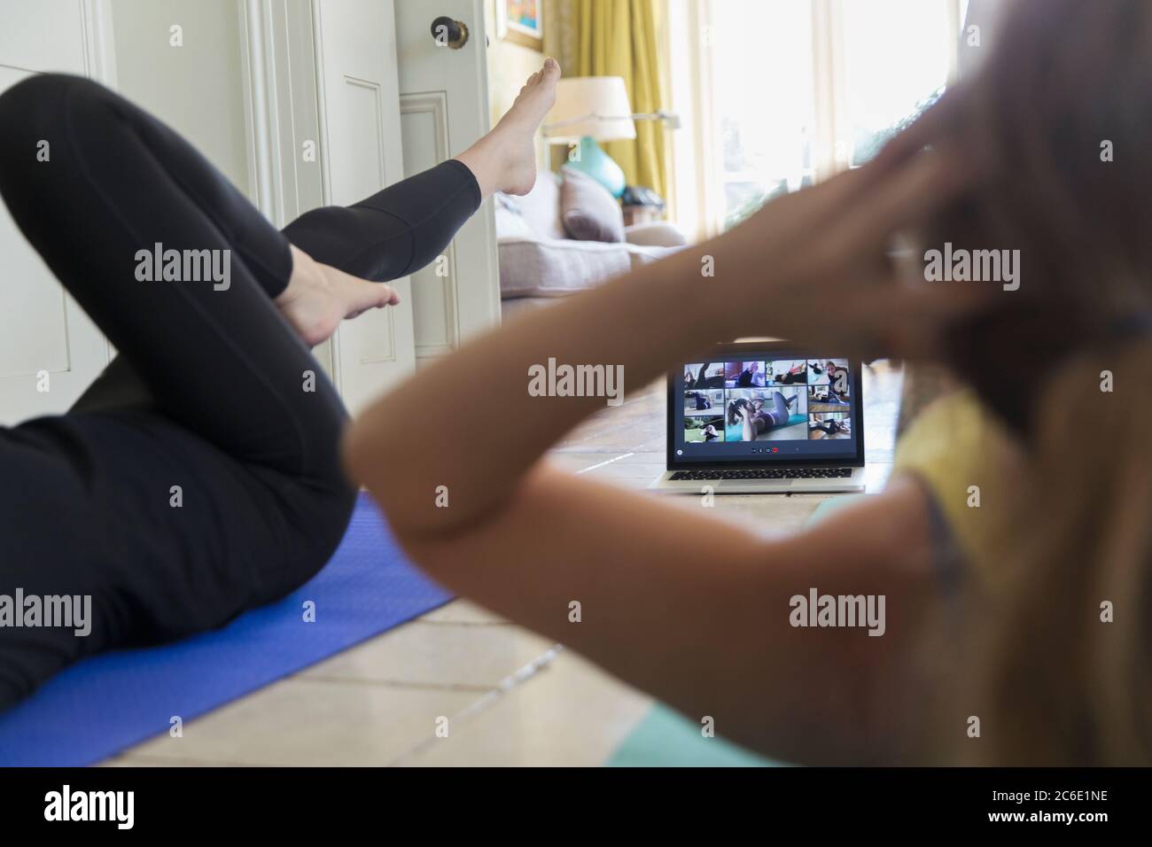Women taking online exercise class with laptop Stock Photo Alamy