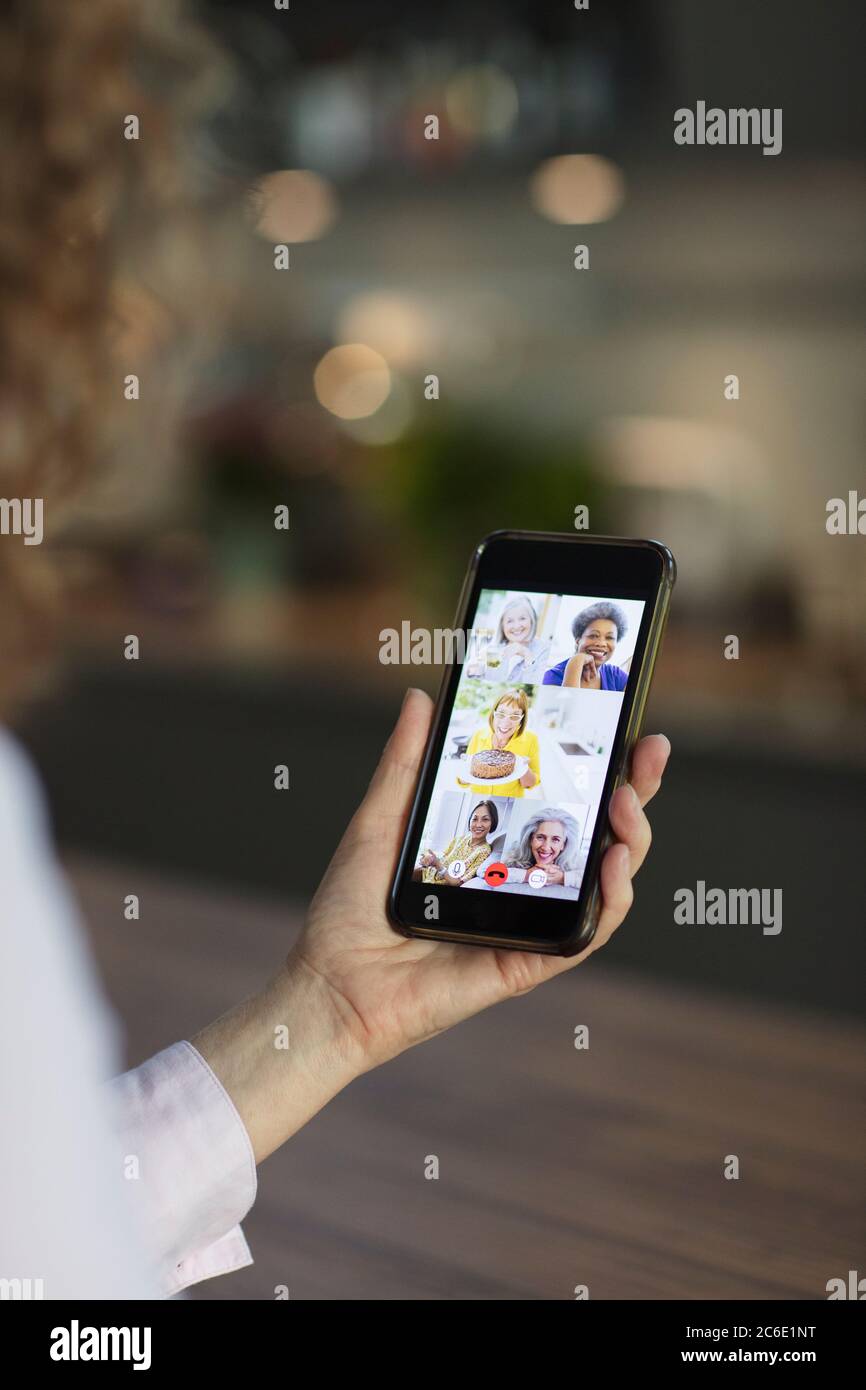 Senior women friends video chatting on smart phone screen Stock Photo