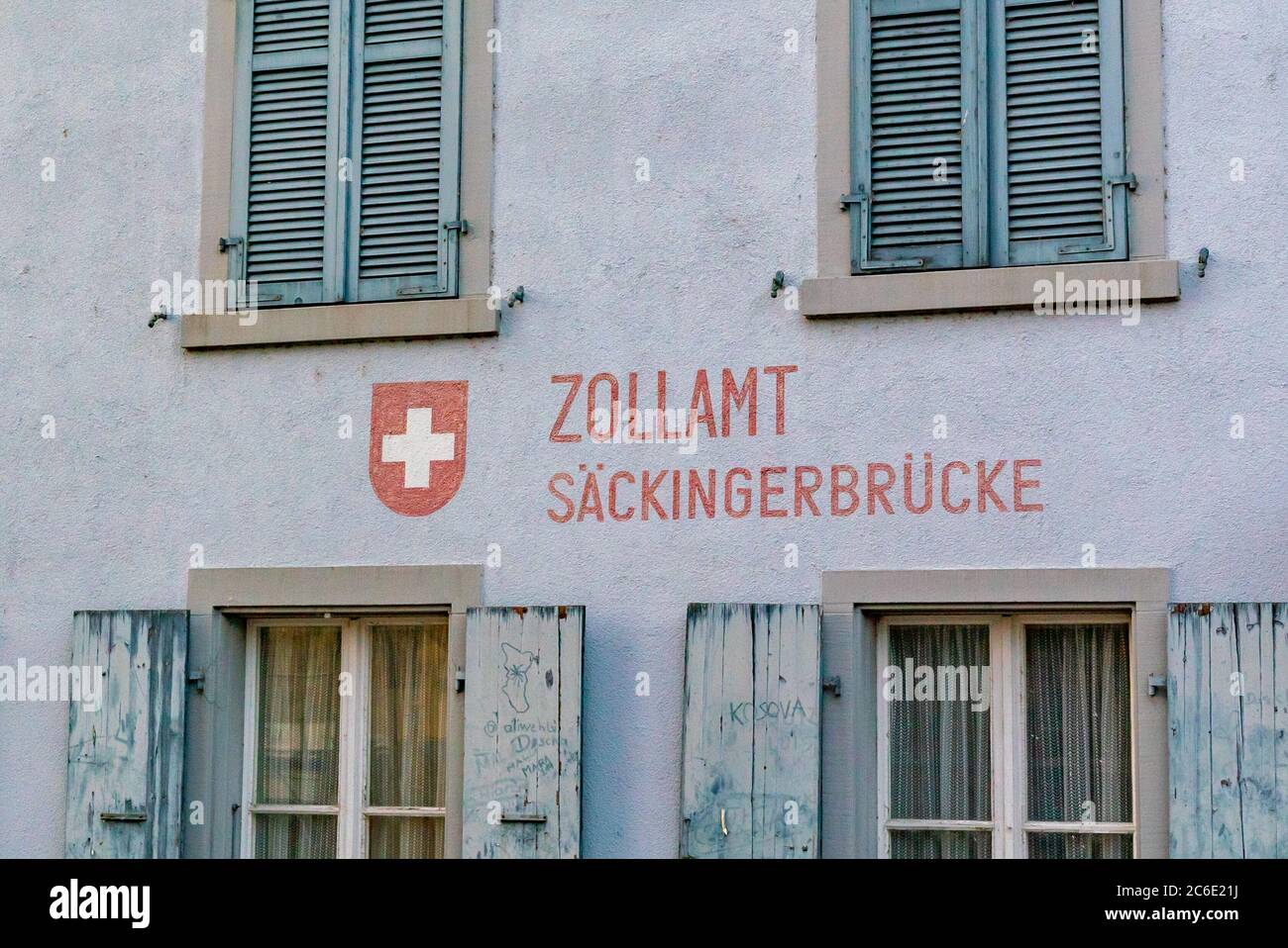 Stein, AG / Switzerland - 4 July 2020: close up of the old customs hosue on the Rhine River with customs office Saeckinger Brdige written in German Stock Photo