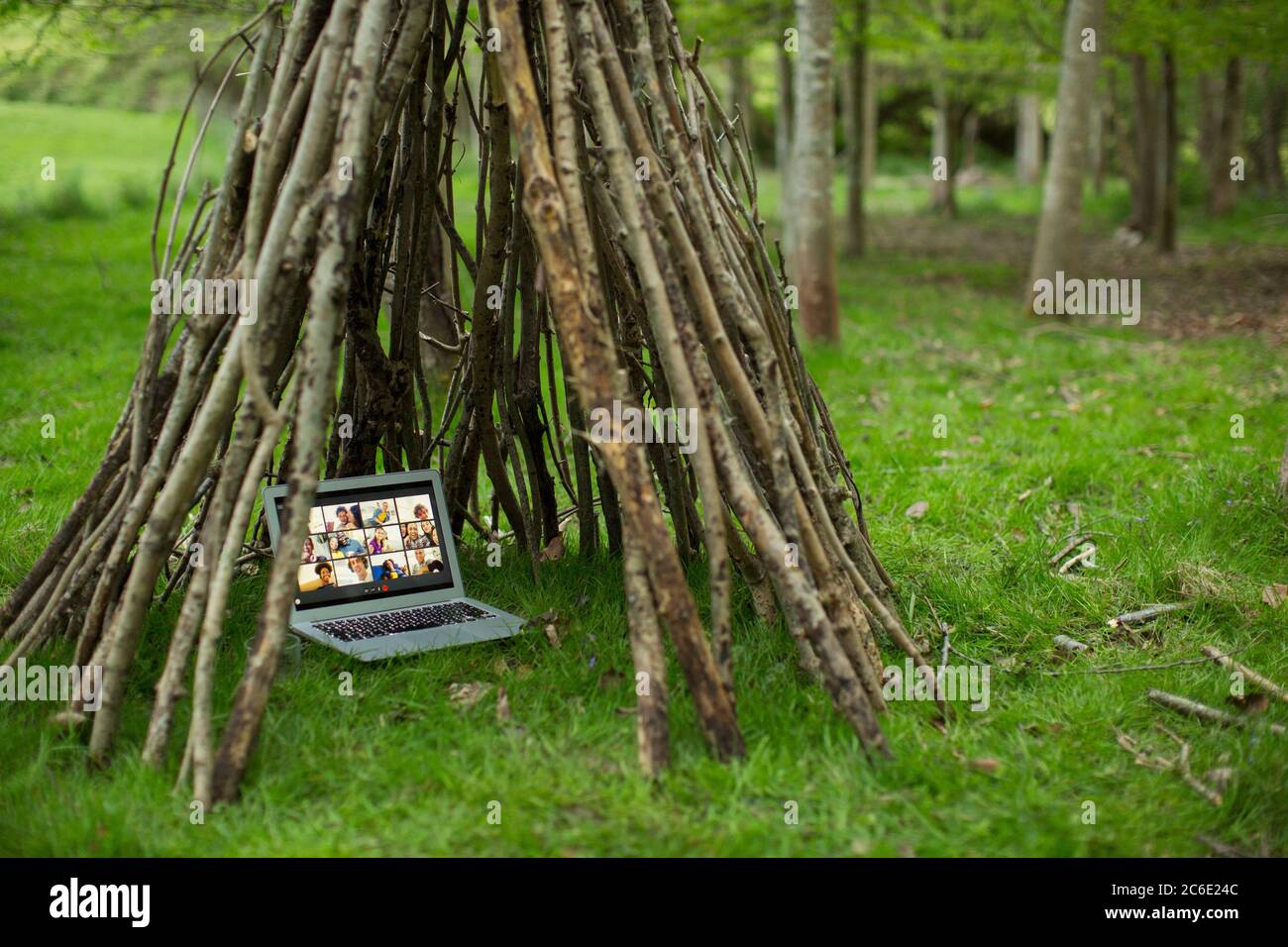 Video conference on laptop screen in branch teepee Stock Photo