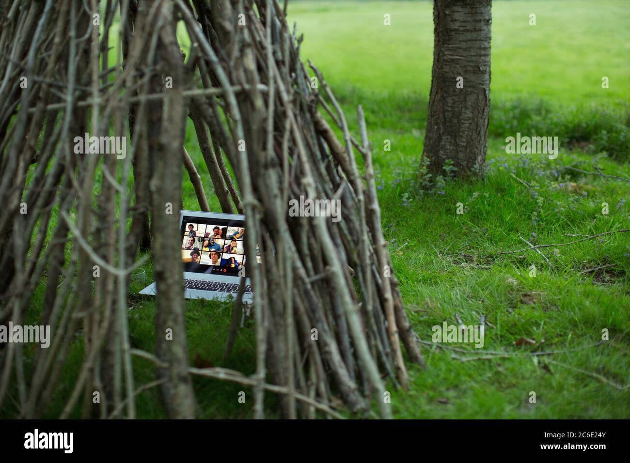 Video conference on laptop in branch teepee Stock Photo