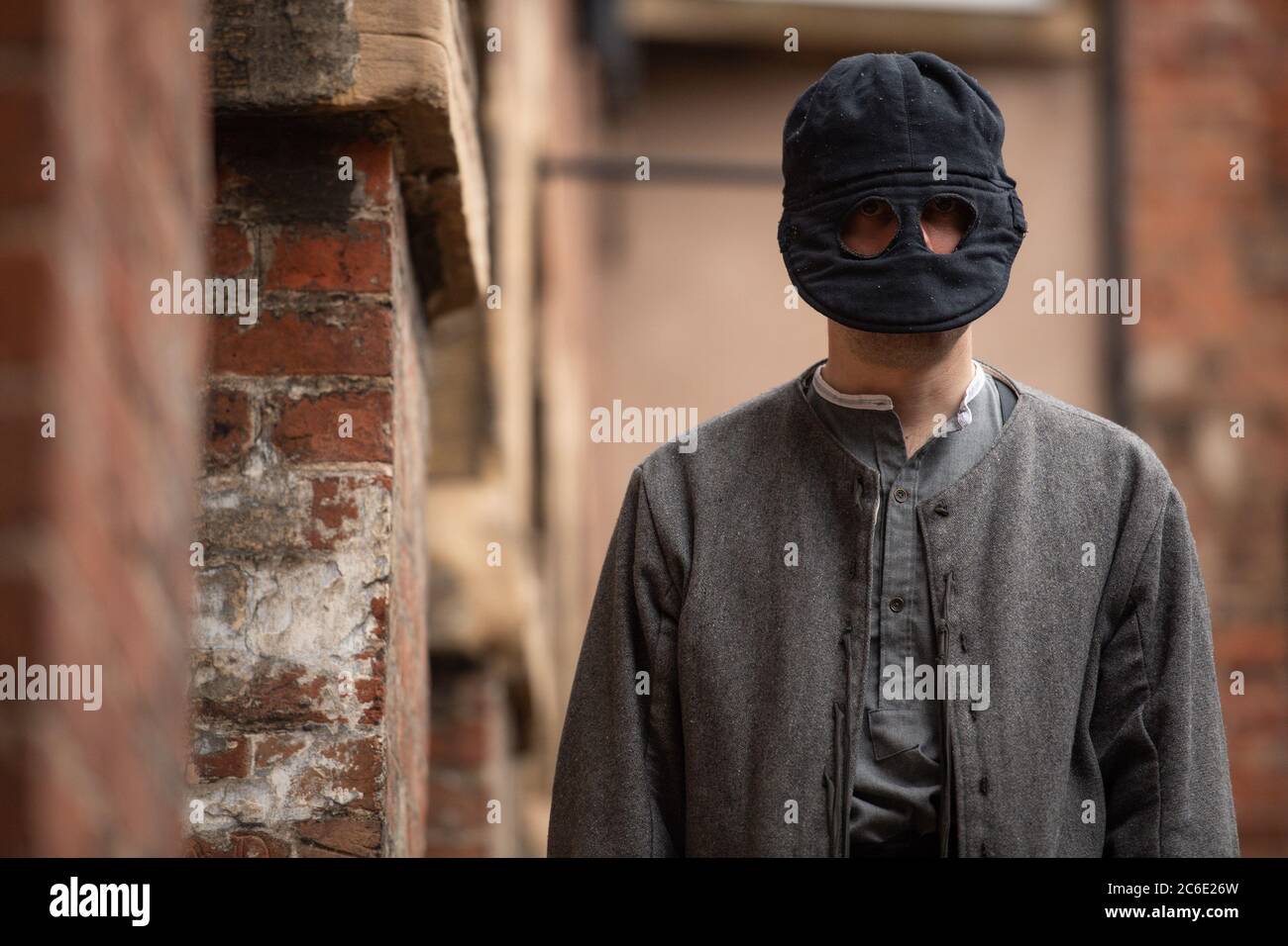 An interpreter poses during a preview of the 'Unmasking the truth