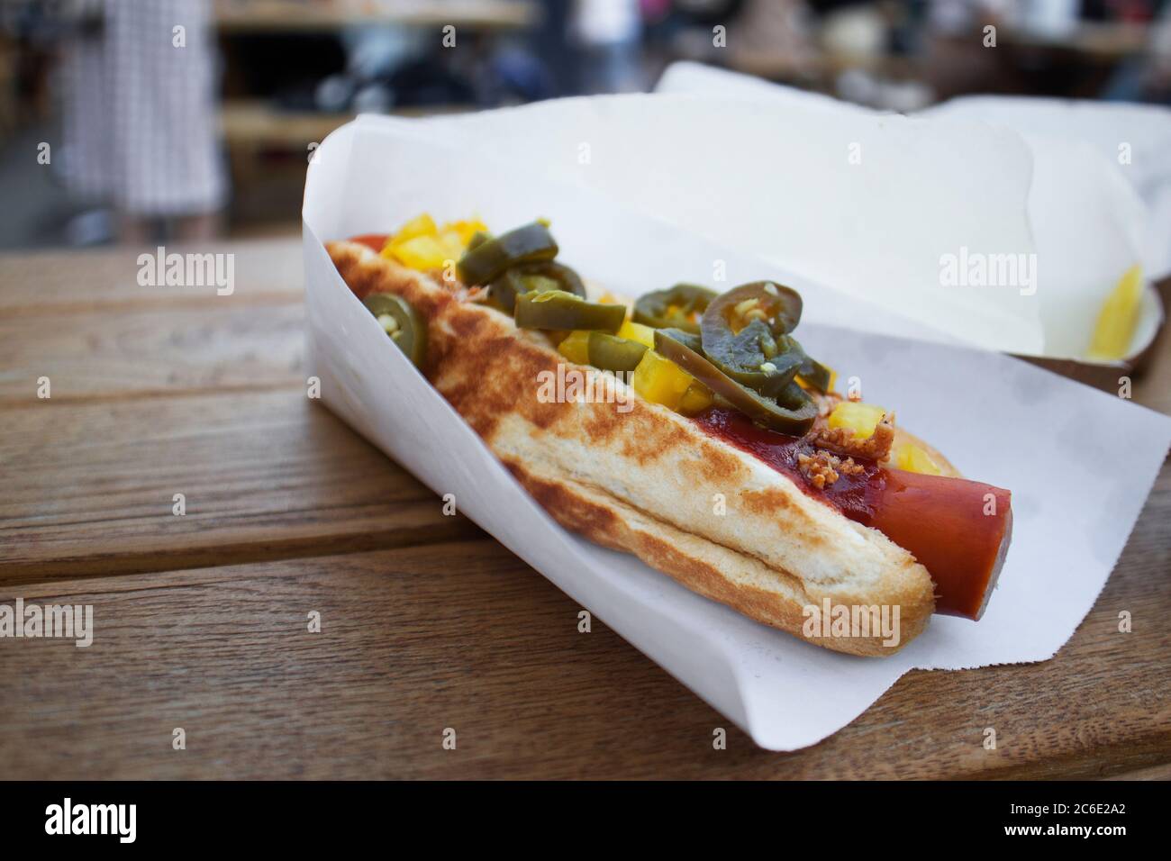Hot dog with grilled sausages, onions and vegetables. Street food Stock Photo