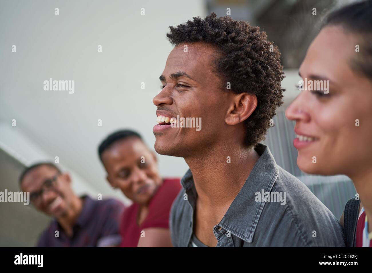 Young man hanging out with friends and laughing Stock Photo