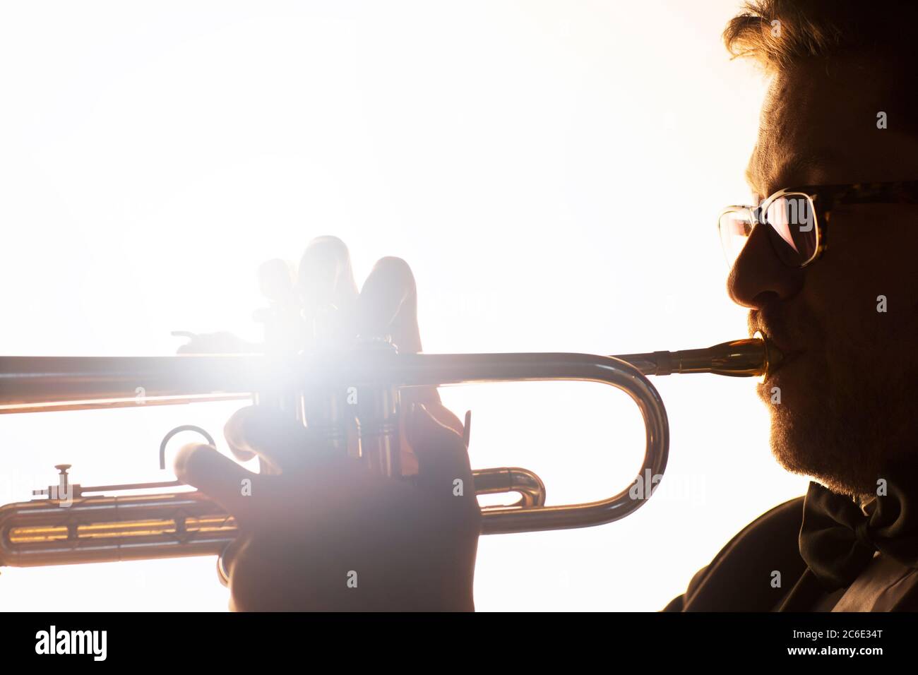 Silhouette of trumpeter performing Stock Photo