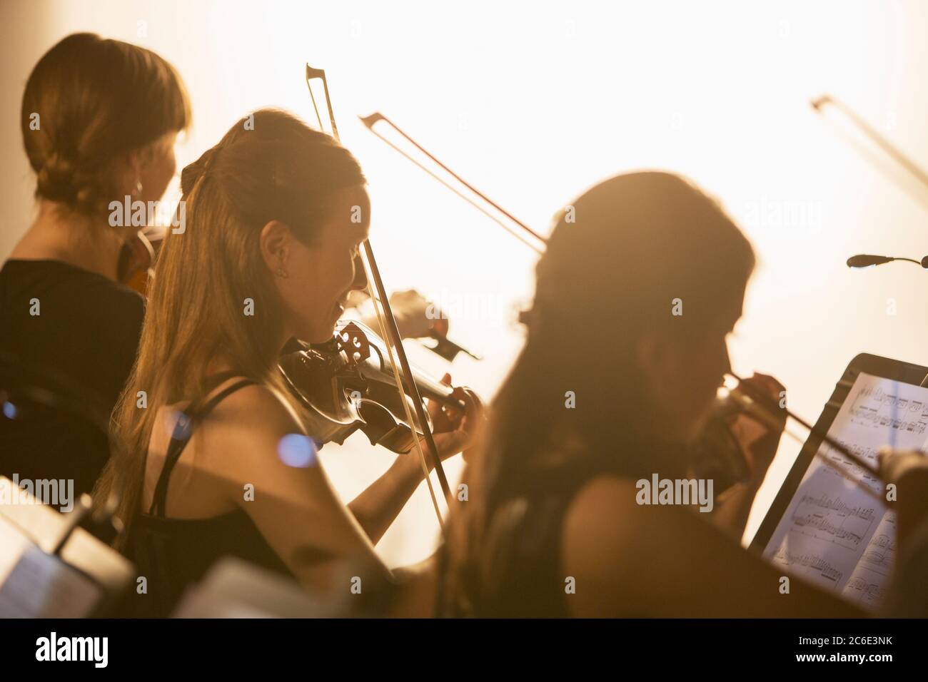Silhouette of orchestra performing Stock Photo