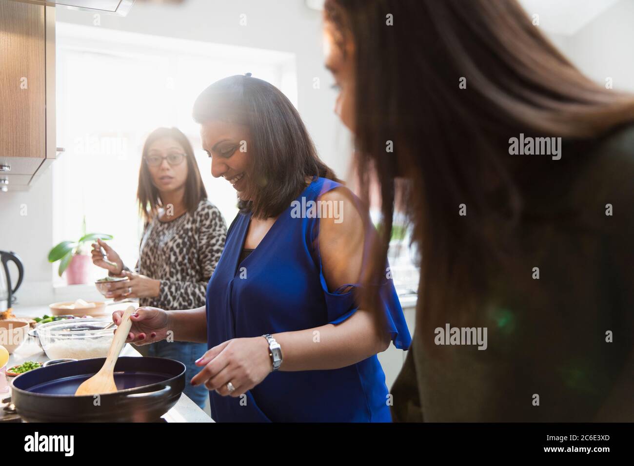 Indian women cooking in kitchen Stock Photo