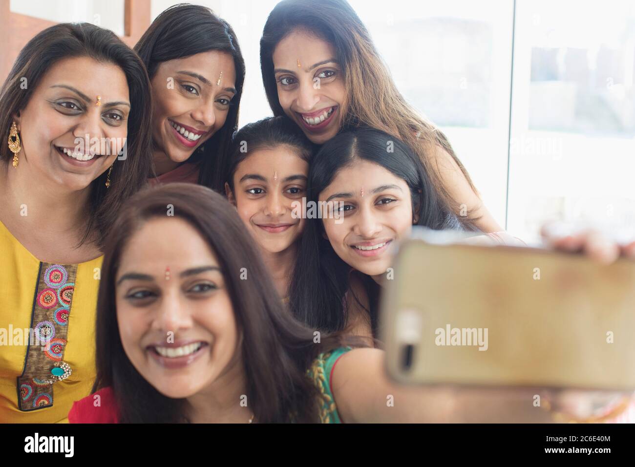 Happy Indian women and girls with binds taking selfie Stock Photo