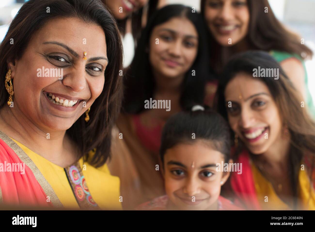 Happy Indian women and girls in bindis Stock Photo