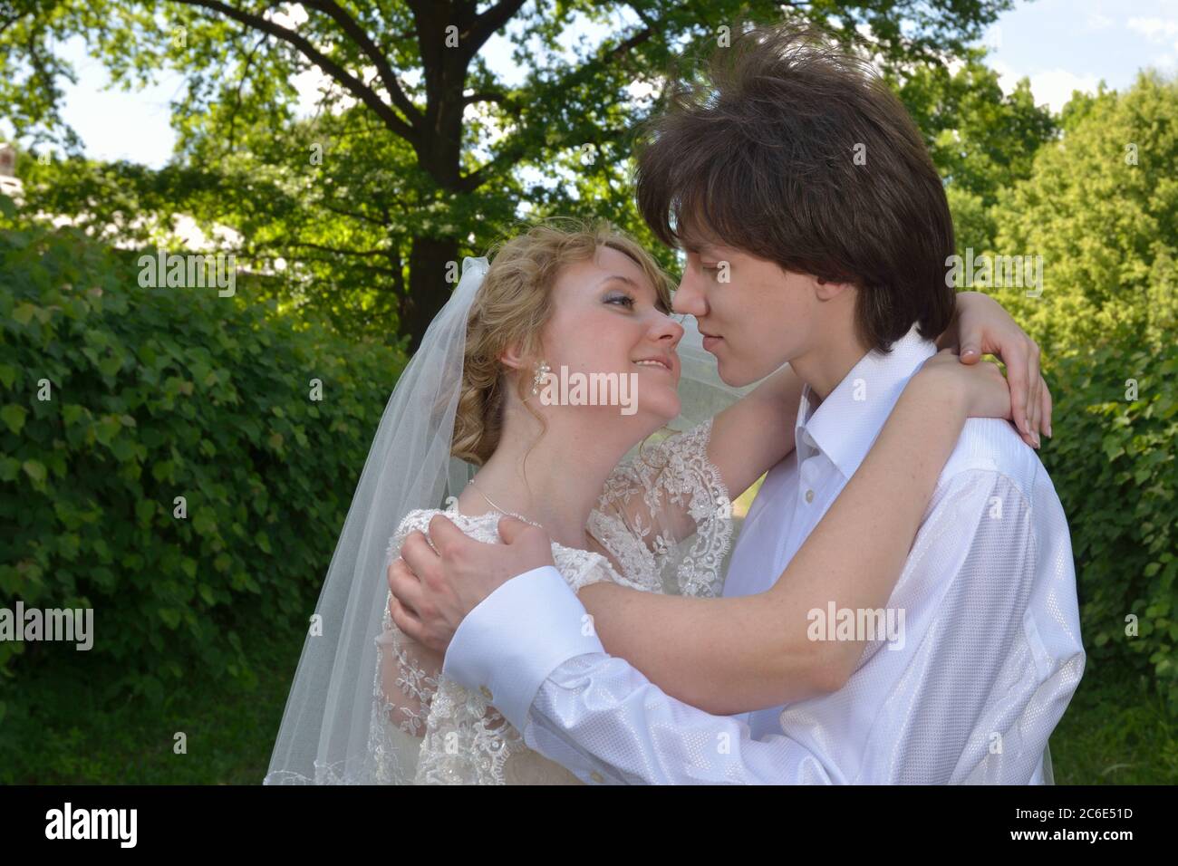 A Just Married Couple Happy Bride And Groom About To Kiss On Their A Just Married Couple Happy Bride And Groom About To Kiss On Their