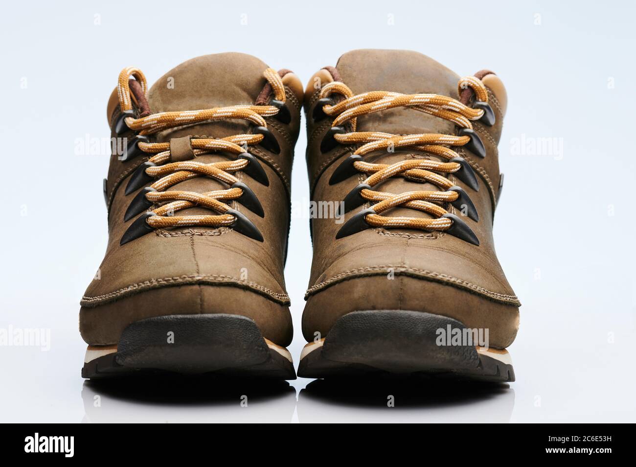 Pair of brown heavy boots front view isolated on white background Stock Photo