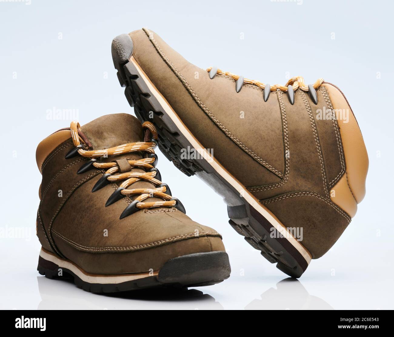 Pair of hiking shoes boots isolated on white background Stock Photo - Alamy