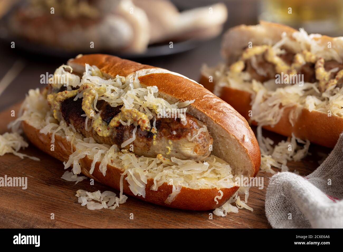 Bratwurst Bun Hi Res Stock Photography And Images Alamy Closeup Of Grilled Bratwurst With Sauerkraut And Dijon Mustard On A Bun 2C6E6A6