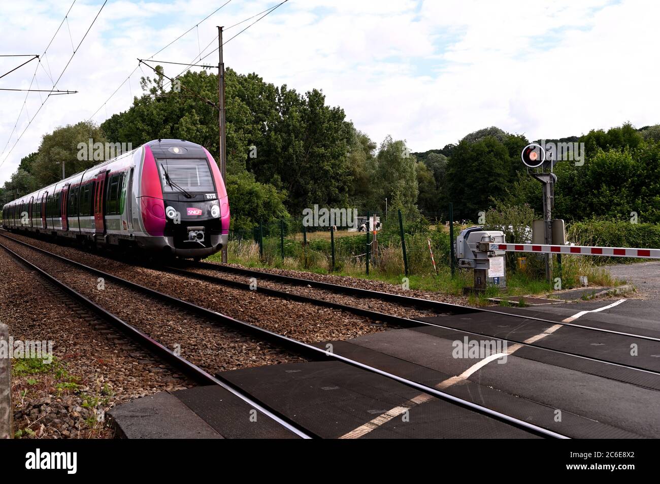 Suburban train going through countryside Stock Photo