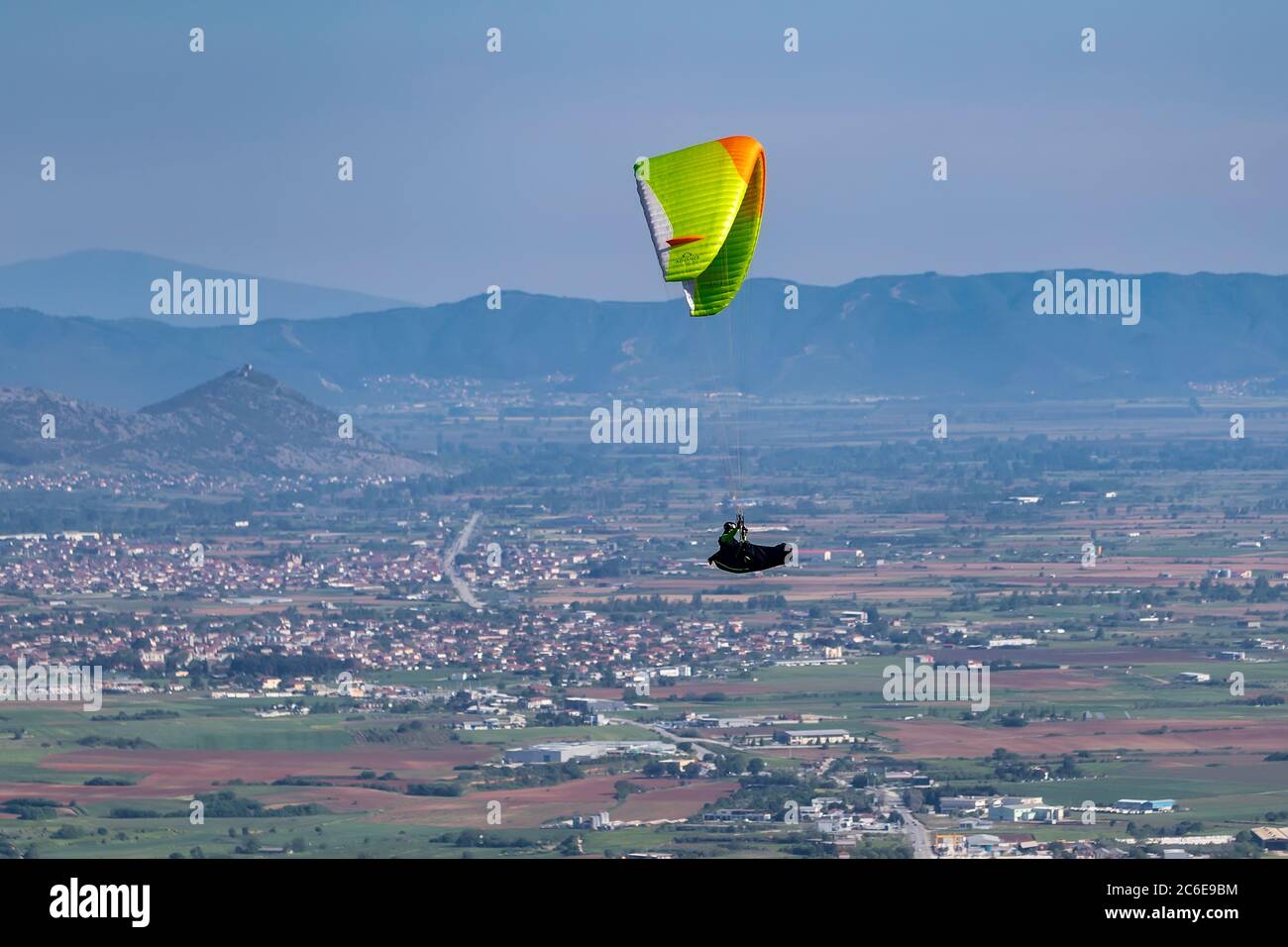 Drama, Greece -  May 5, 2020: Paraglider in the popular area for parachuting on the side of Korylovos in Drama Stock Photo
