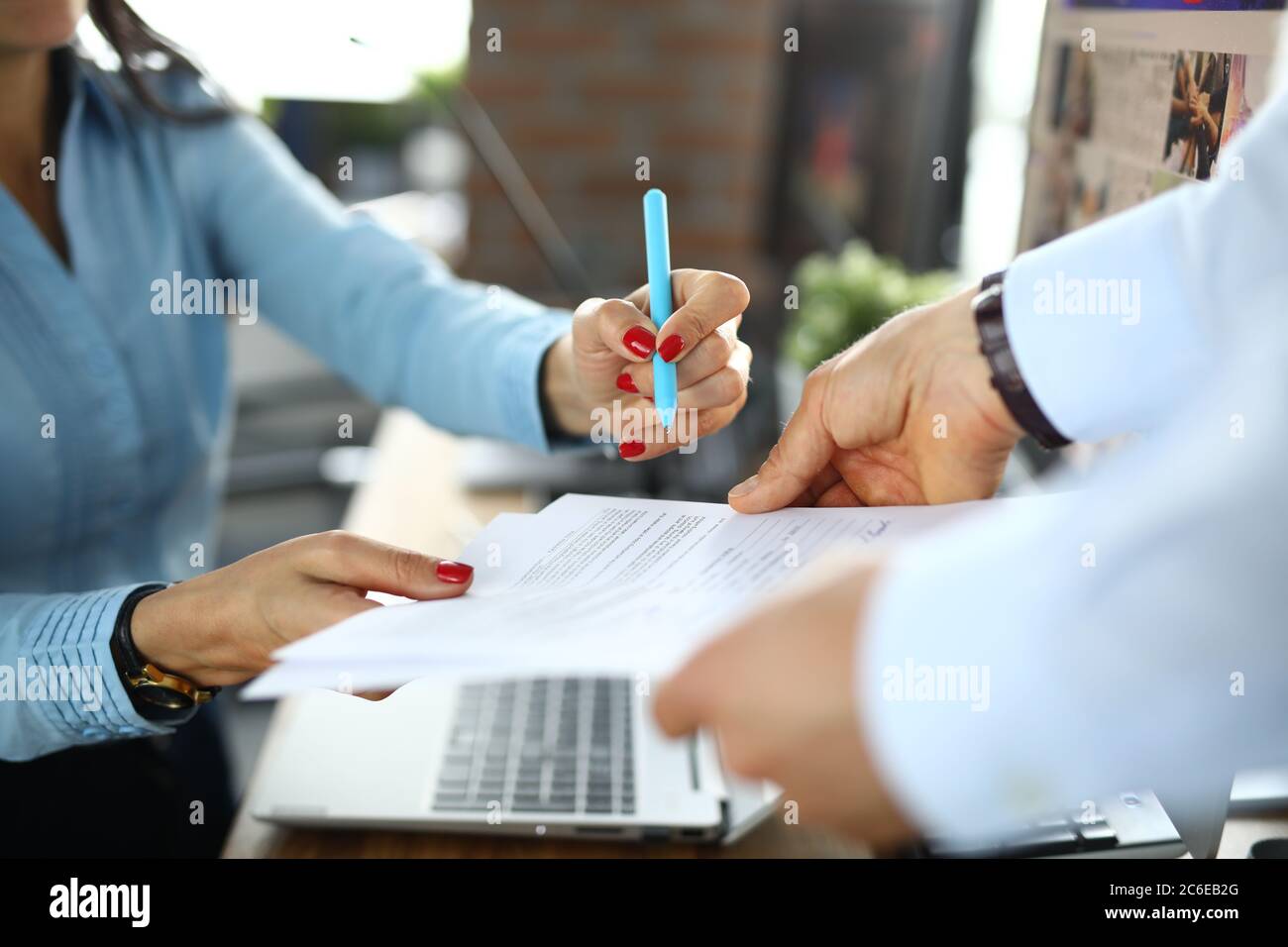 Business woman signs contract in office closeup Stock Photo