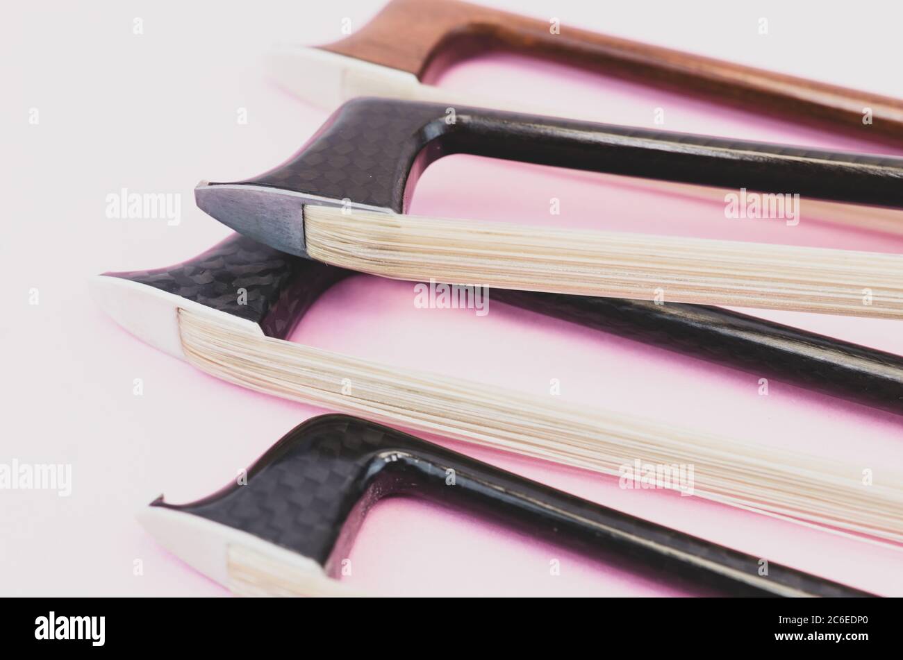 pernambuco wood and carbon fiber violin bows objects and materials Stock Photo Alamy