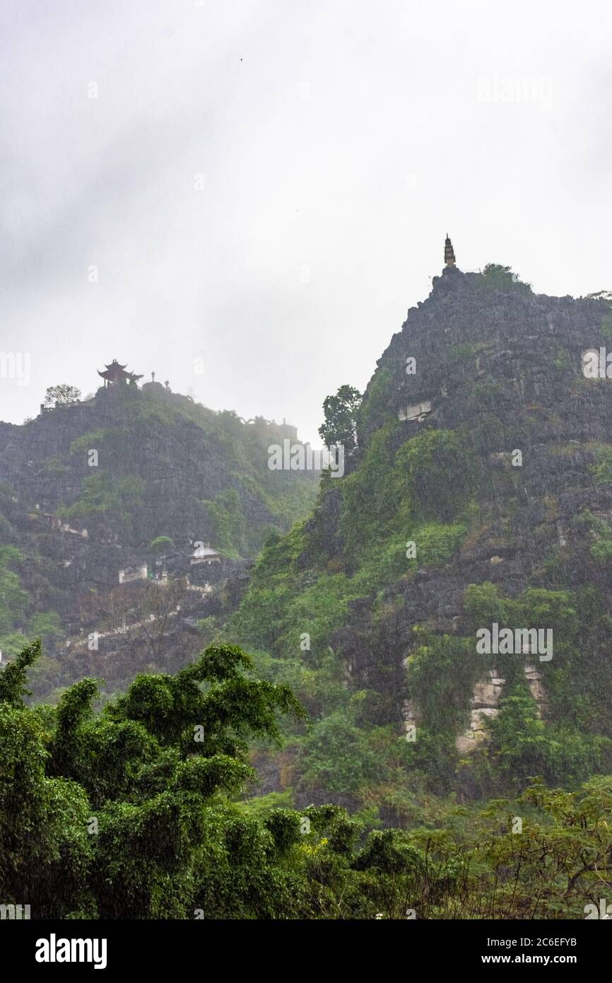 Pagoda of the Huang Mua Mountain in Tam Coc during heavy rain, Vietnam ...