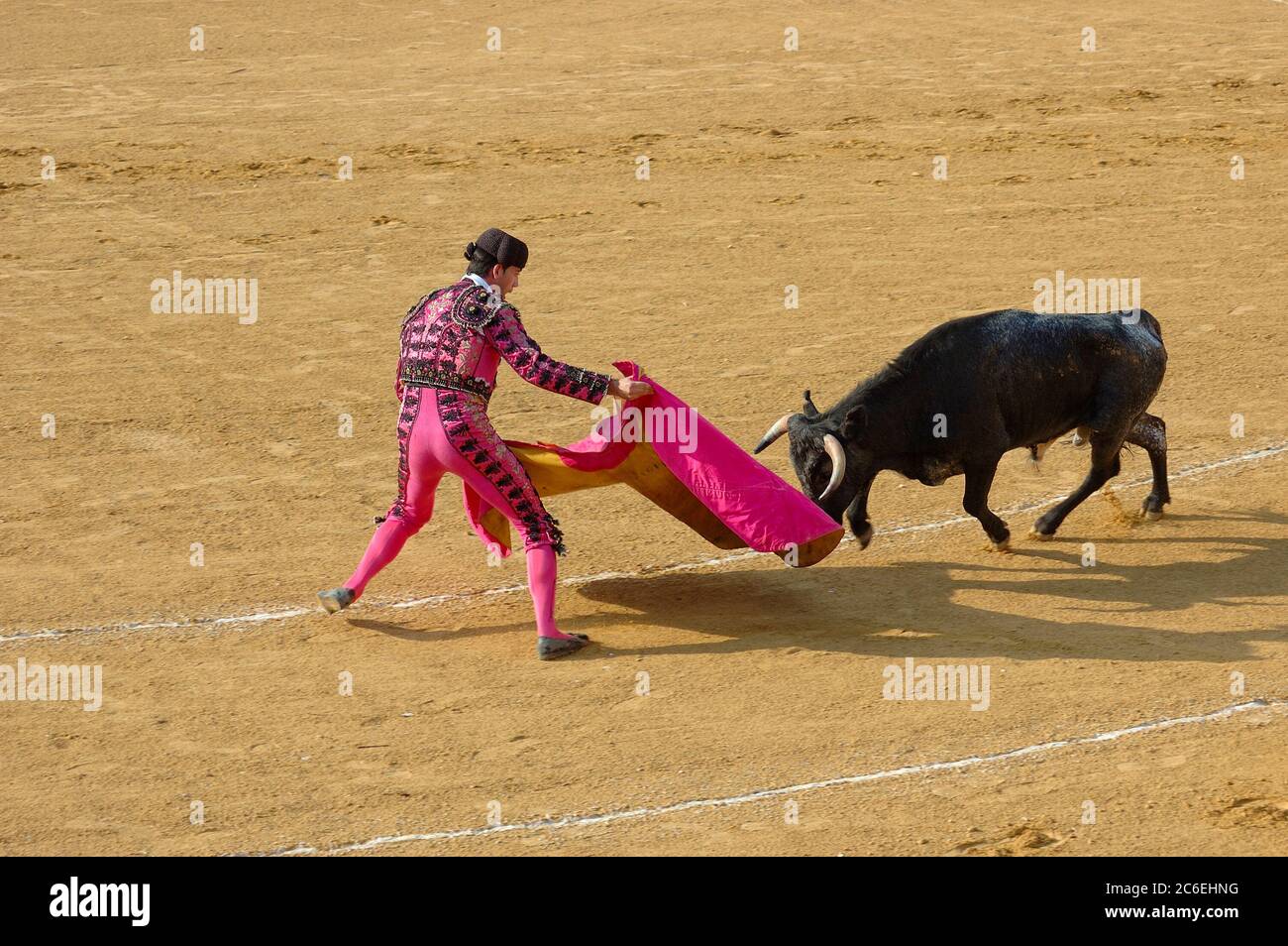 ANDALUSIA – AUGUST 13: Corrida typical Spanish entertainment - bullfighting. Unidentified torero fights against a bull on 13 August 2006 in Benalmaden Stock Photo