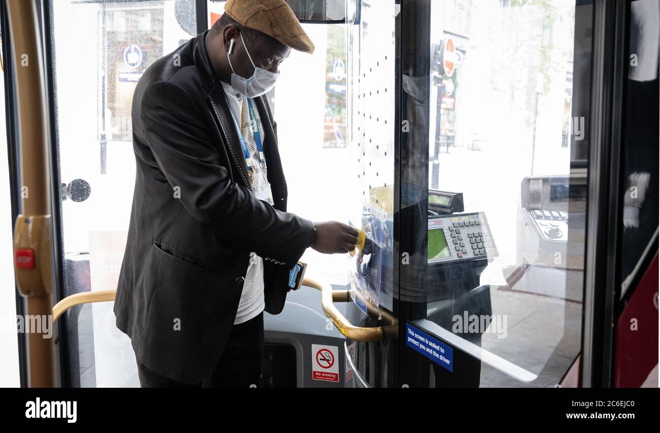 Commuters wearing face masks on London buses. Route 26 bus to Waterloo