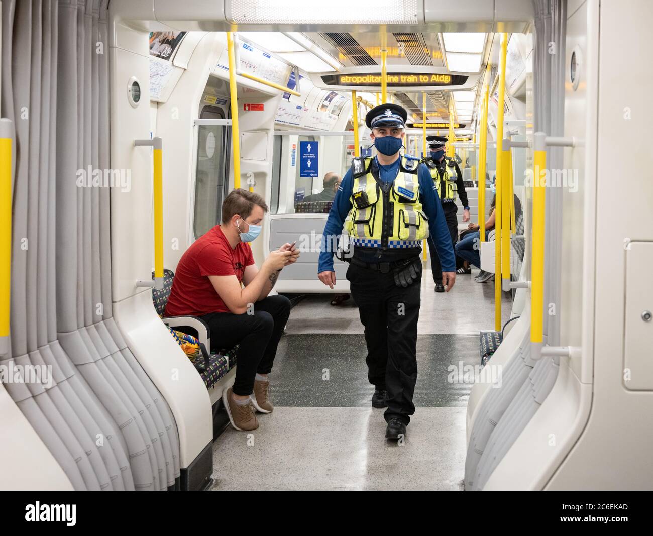 Commuters wearing face masks on the London Underground . British