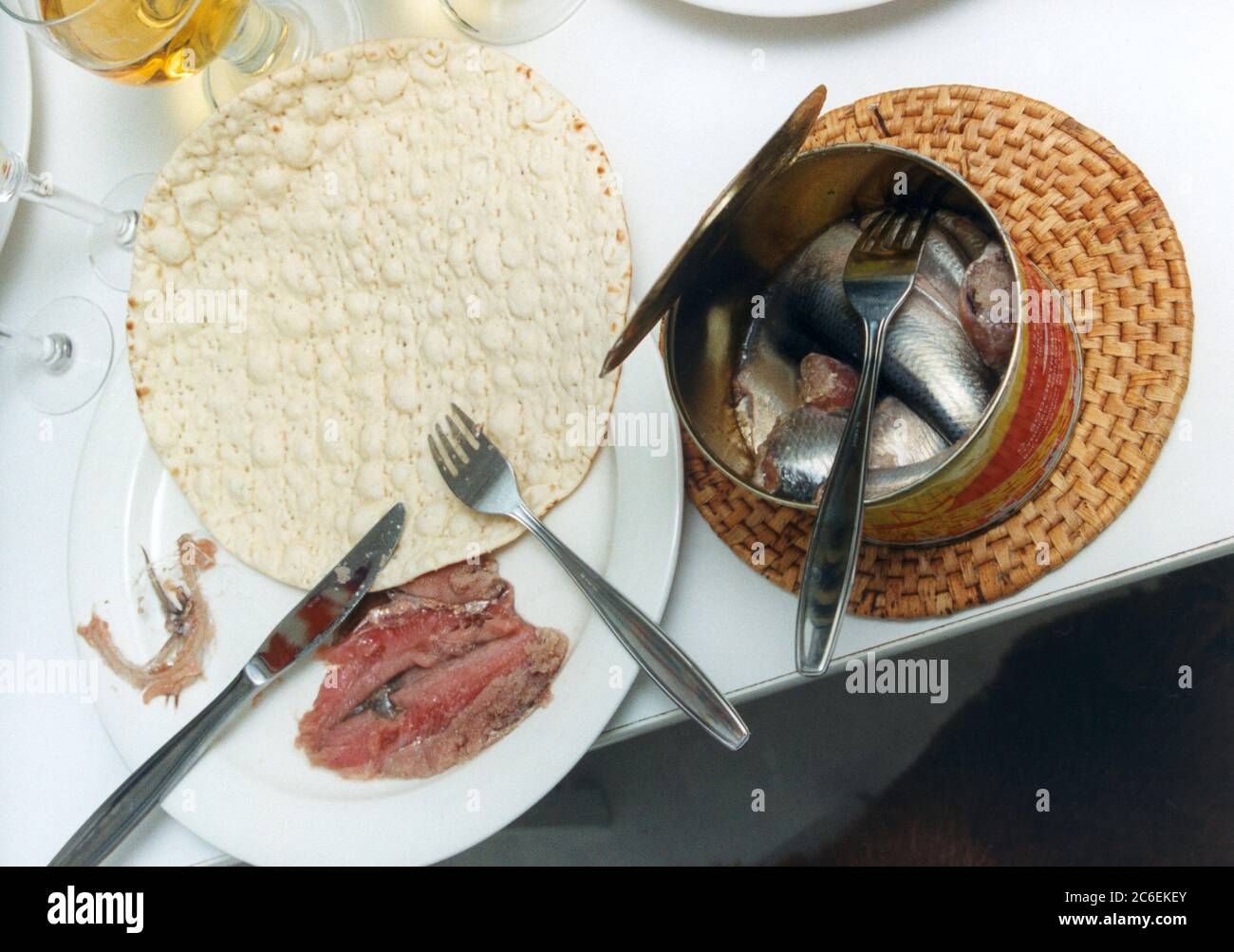 SURSTRÖMMING Sour Herring prepared to eat with flatbread Stock Photo