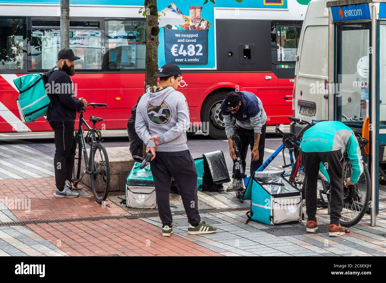 Cork, Ireland. 9th July, 2020. Patrick Street in Cork was busy this afternoon as the country gets back to a new 'normal'. These Deliveroo delivery riders said they're no busier now than before the lockdown. Credit: AG News/Alamy Live News Stock Photo