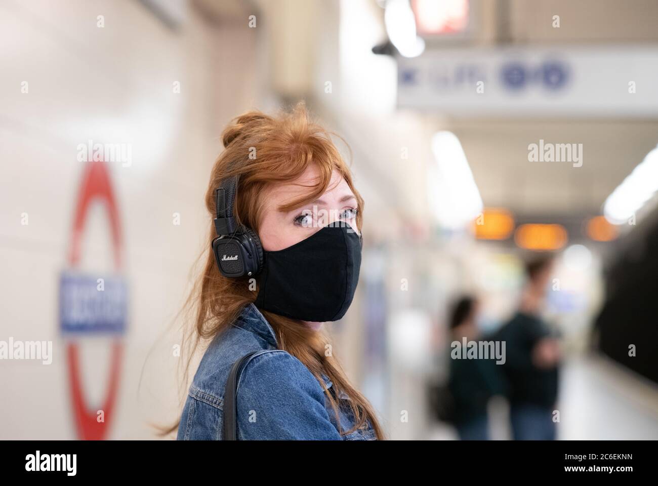 Commuters wearing face masks on the London Underground . District and