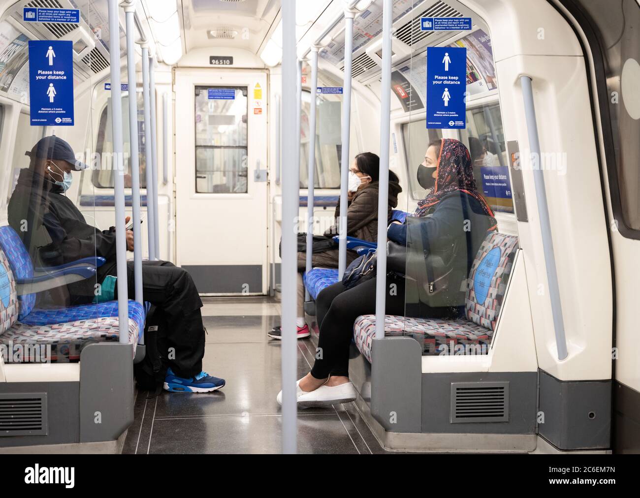 Commuters wearing face masks on the London Underground . Jubilee line