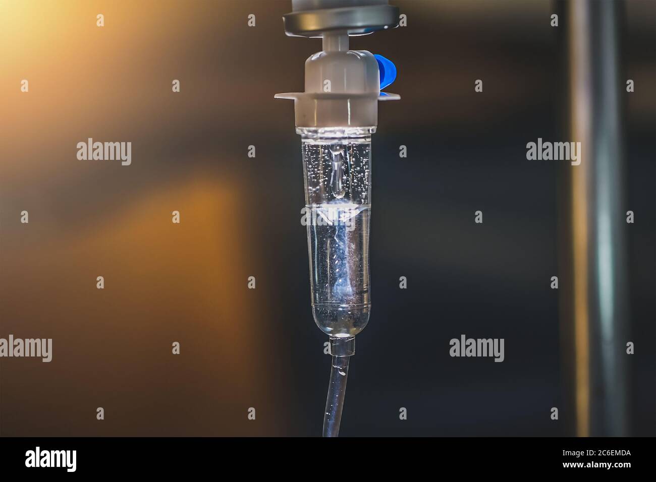 Close up saline IV drip Infusion bottle with IV solution for patient in ward hospital Stock Photo