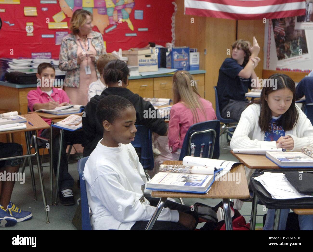 Pflugerville, Texas September 14, 2005:  Eighth grader and Hurricane Katrina evacuee  Herbert Barrington participates in Roberta Sherfy's World Geography class Wednesday, his second week of school in Texas. Barrington's mother, a newspaper reporter, is working in Louisana covering hurricane cleanup efforts. Stock Photo