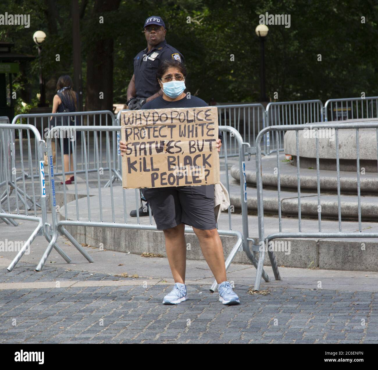 Demonstrator with a question at Columbus Circle in Manhattan, New York City. Stock Photo