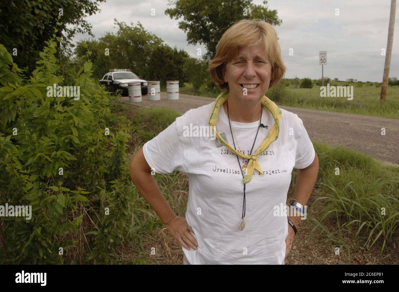 Crawford, Texas August 28, 2005:  Anti-war activist Cindy Sheehan stands at a blockade on the road leading to the ranch of  U.S. President George W. Bush about 10 miles out of Crawford. Sheehan, whose son Casey died in action in Iraq in 2004, has organized a series of protests near the Bushes' Texas ranch during the president's summer vacation there.  ©Bob Daemmrich Stock Photo