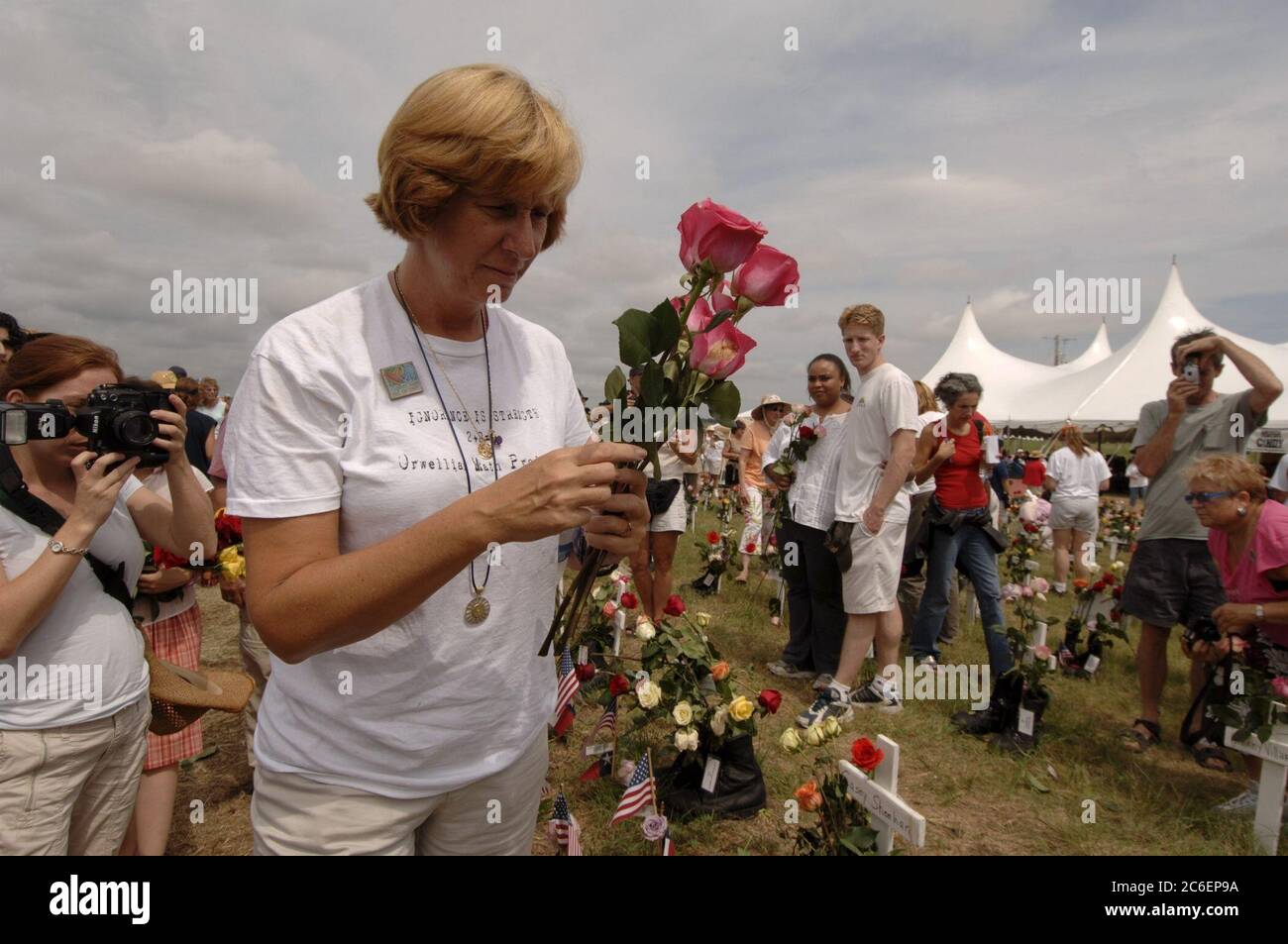 Crawford, Texas August 28, 2005: Anti-war activist Cindy Sheehan places roses on a display of crosses at Camp Casey II during Sunday activities near President Bush's ranch. Crawford, Texas August 28, 2005: Anti-war activist Cindy Sheehan (right) says goodbye to Rev. Al Sharpton (left) at Camp Casey II near U.S. President George W. Bush's Texas ranch. Sheehan, whose son Casey died in action in Iraq in 2004, has organized a series of protests near the Bushes' Texas ranch during the president's summer vacation there.  ©Bob Daemmrich  ©Bob Daemmrich Stock Photo