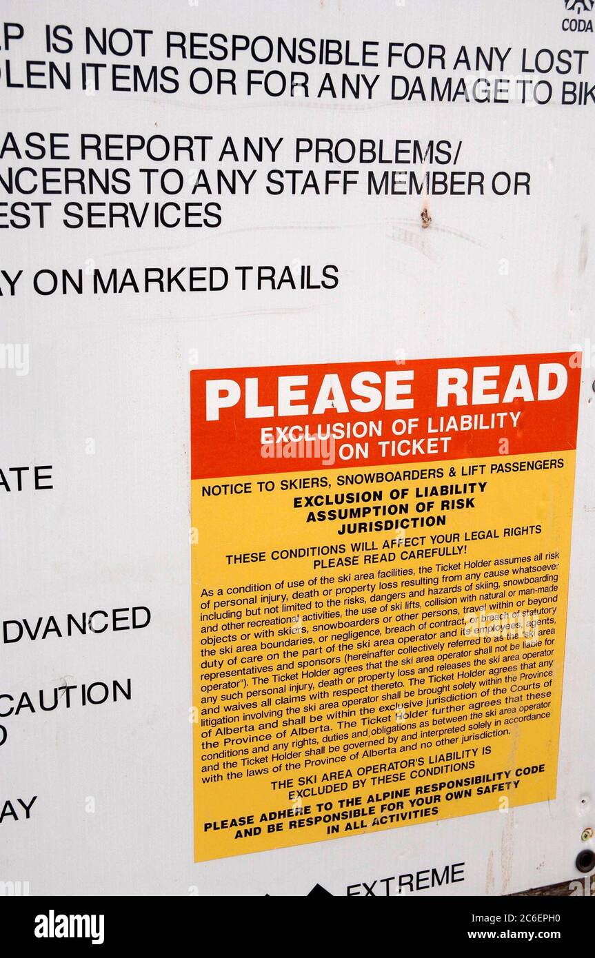 Calgary, Alberta Canada, July 2005:  Warning signs with liability release at Canada Olympic Park mountain bike trails. ©Bob Daemmrich Stock Photo