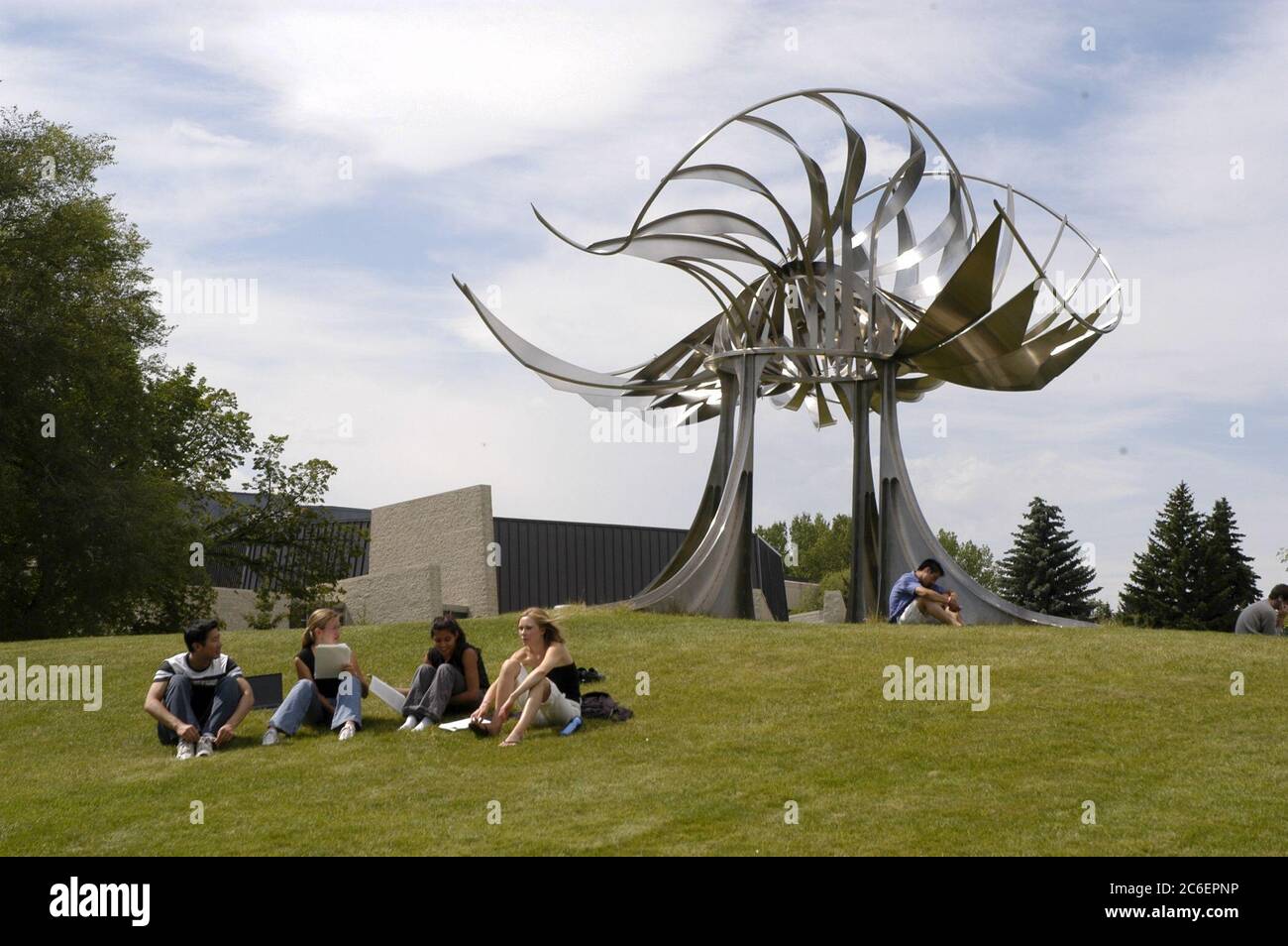 Calgary, Alberta CANADA July 27, 2005: Students lounge in front of outdoor sculpture on the campus of the University of Calgary, Alberta.  ©Bob Daemmrich Stock Photo