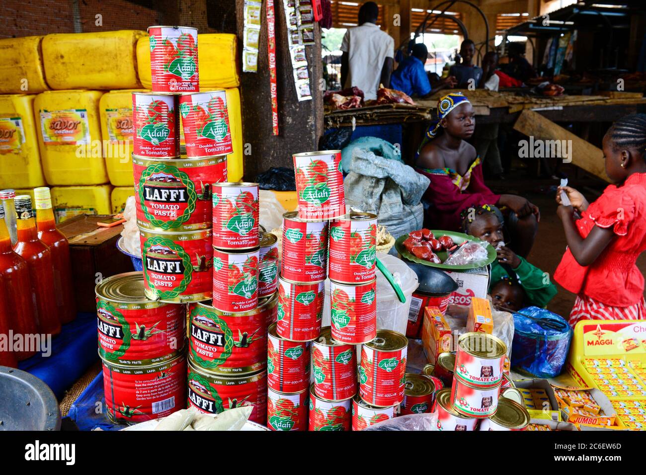 BURKINA FASO, Bobo Dioulasso, Grande MARCHE, sale of spices, vegetable oil,  Maggi cubes of Nestle Swiss company, and canned tomato paste, brand Laffi  of Chinese company Yuyao Yijia food technology Co Stock