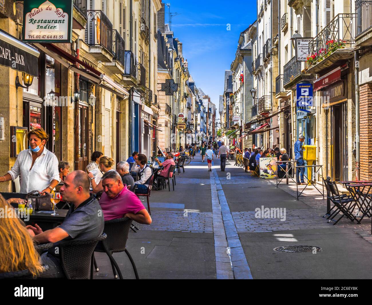 Lunchtime view of diners in cafes along Rue Colbert in the old quarter of Tours, Indre-et-Loire, France. Stock Photo