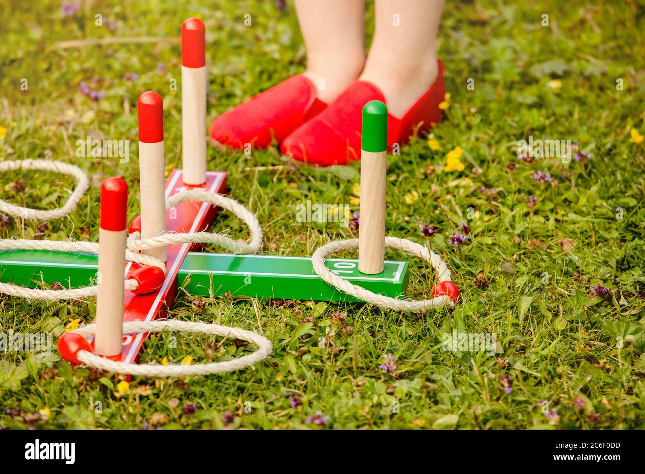 Close up view of ring pole tossing game outdoors in home garden, summer day. Family garden play time concept. Stock Photo