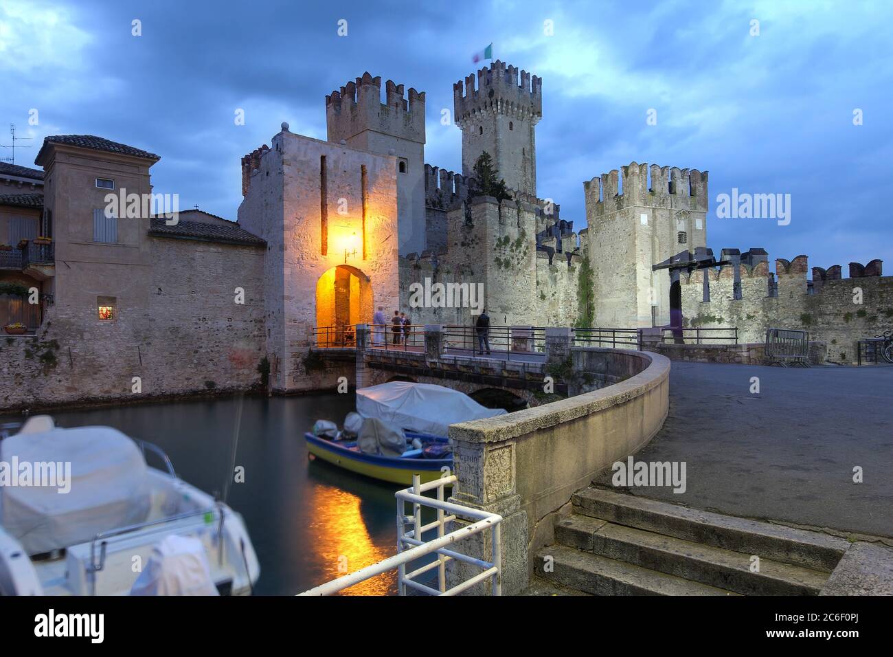 Night scene of Scaliger Castle, an old fortification guarding the entrance in Sirmione on Lake Garda, Italy Stock Photo
