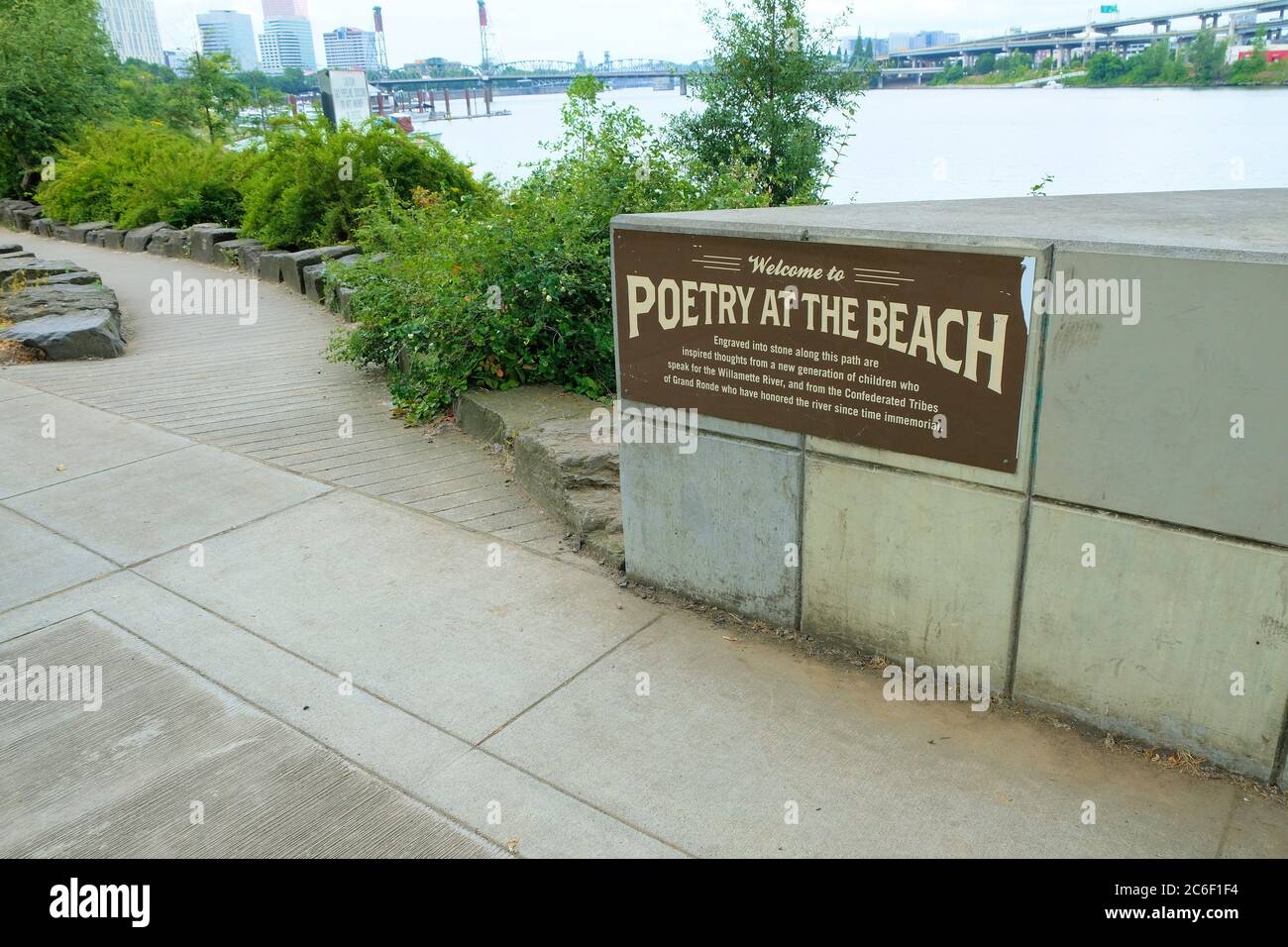 Sign at Poet's Beach, beneath Marquam Bridge near the Waterfront District and downtown Portland, Oregon; Poetry on the Beach at the Willamette River. Stock Photo