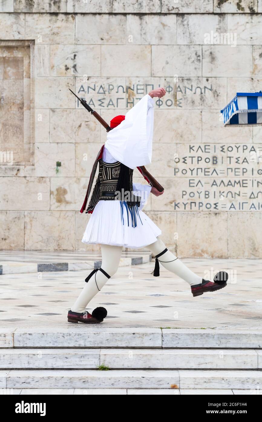 Evzones guarding the Tomb of the Unknown Soldier in Athens, Greece. Greek soldier Evzones dressed in traditional uniforms, refers to the members of th Stock Photo