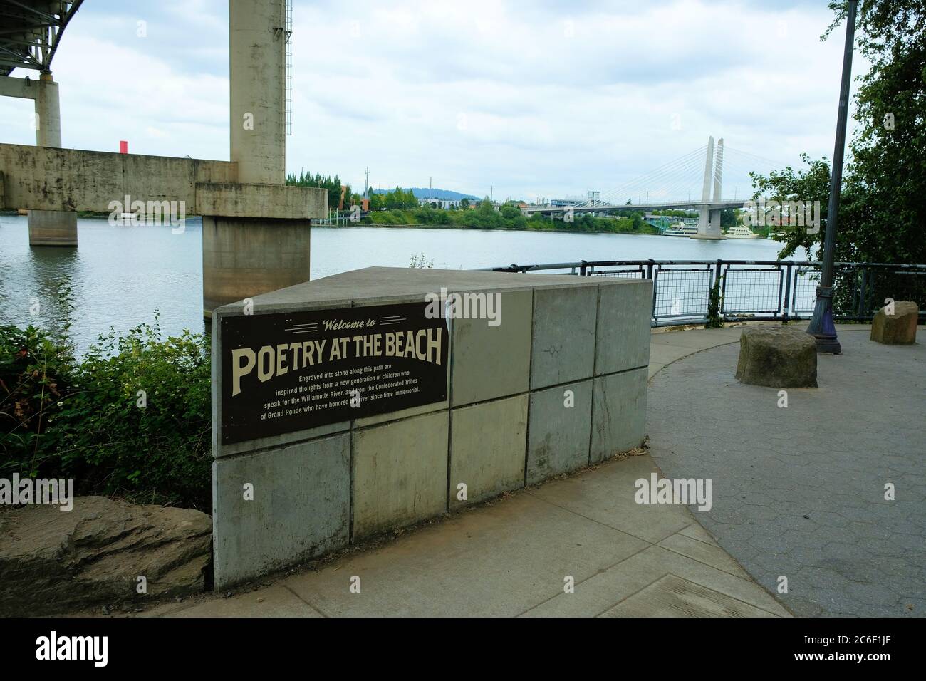 Sign at Poet's Beach, beneath Marquam Bridge near the Waterfront District and downtown Portland, Oregon; Poetry on the Beach at the Willamette River. Stock Photo