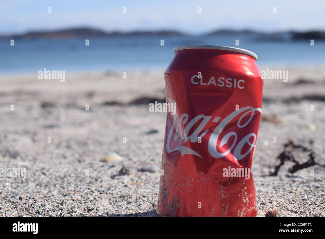 Coca Cola can on the beach Stock Photo