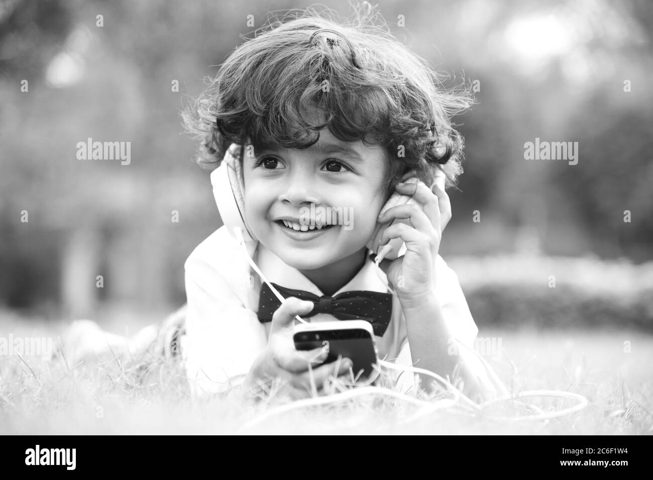 little boy listening music in headphones stock image Stock Photo