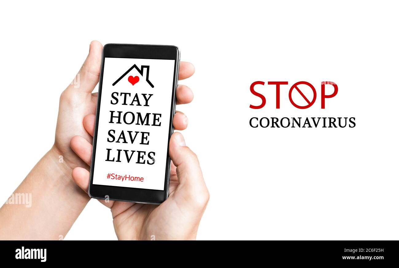 Man hand with mobile smartphone with Stay Home challenge. Stay home during the coronavirus pandemic. Stay at home advice to stop coronavirus COVID-19 Stock Photo