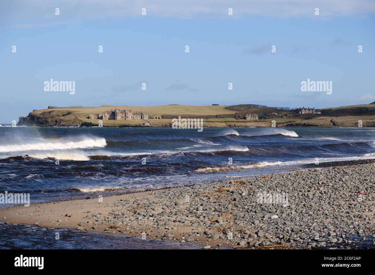 View across the bay at the rocky Runkerry Beach at Portballintrae in County Antrim, Northern Ireland Stock Photo