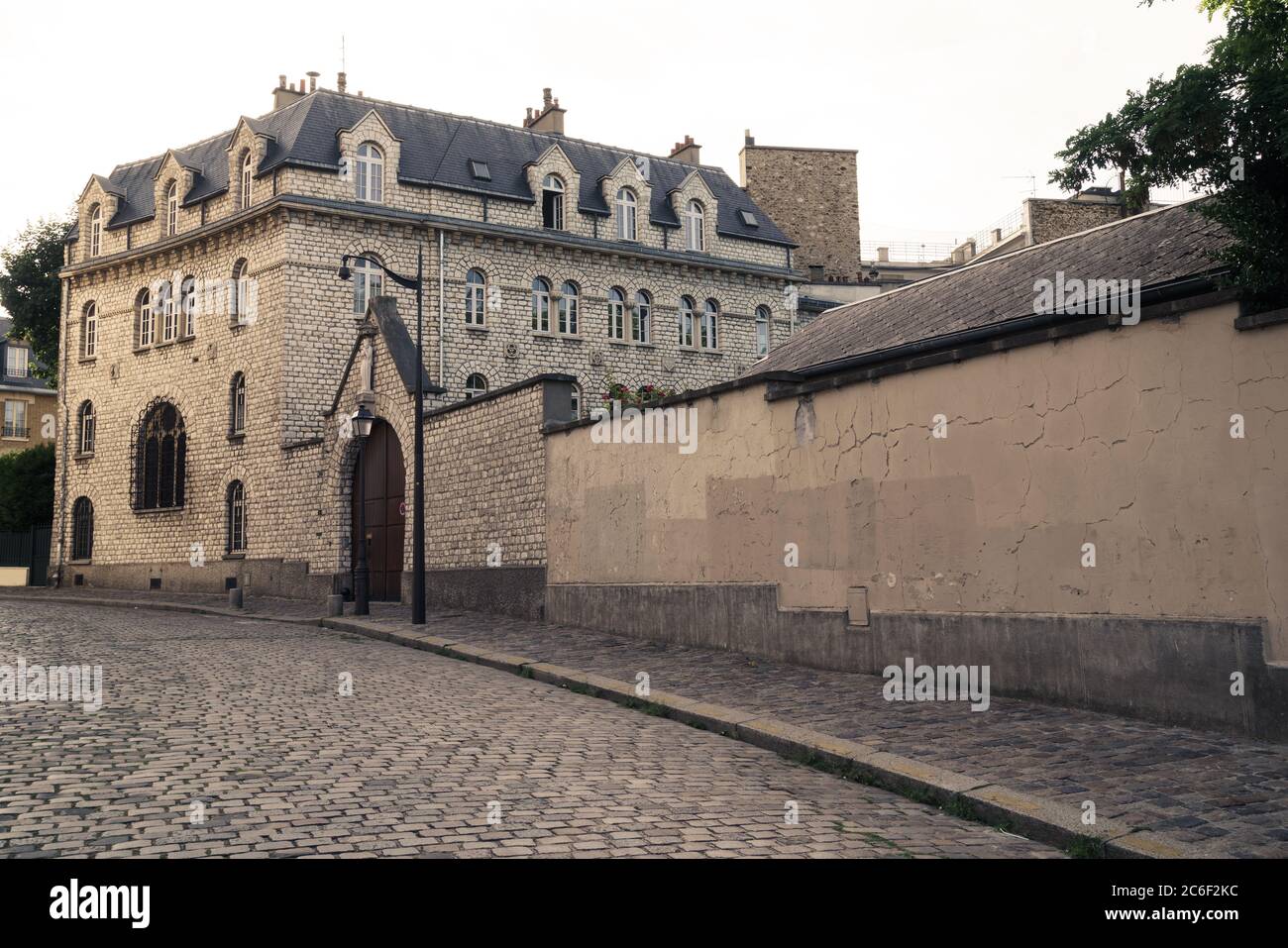 Empty Parisian cobbled street with an old house in the background Stock Photo