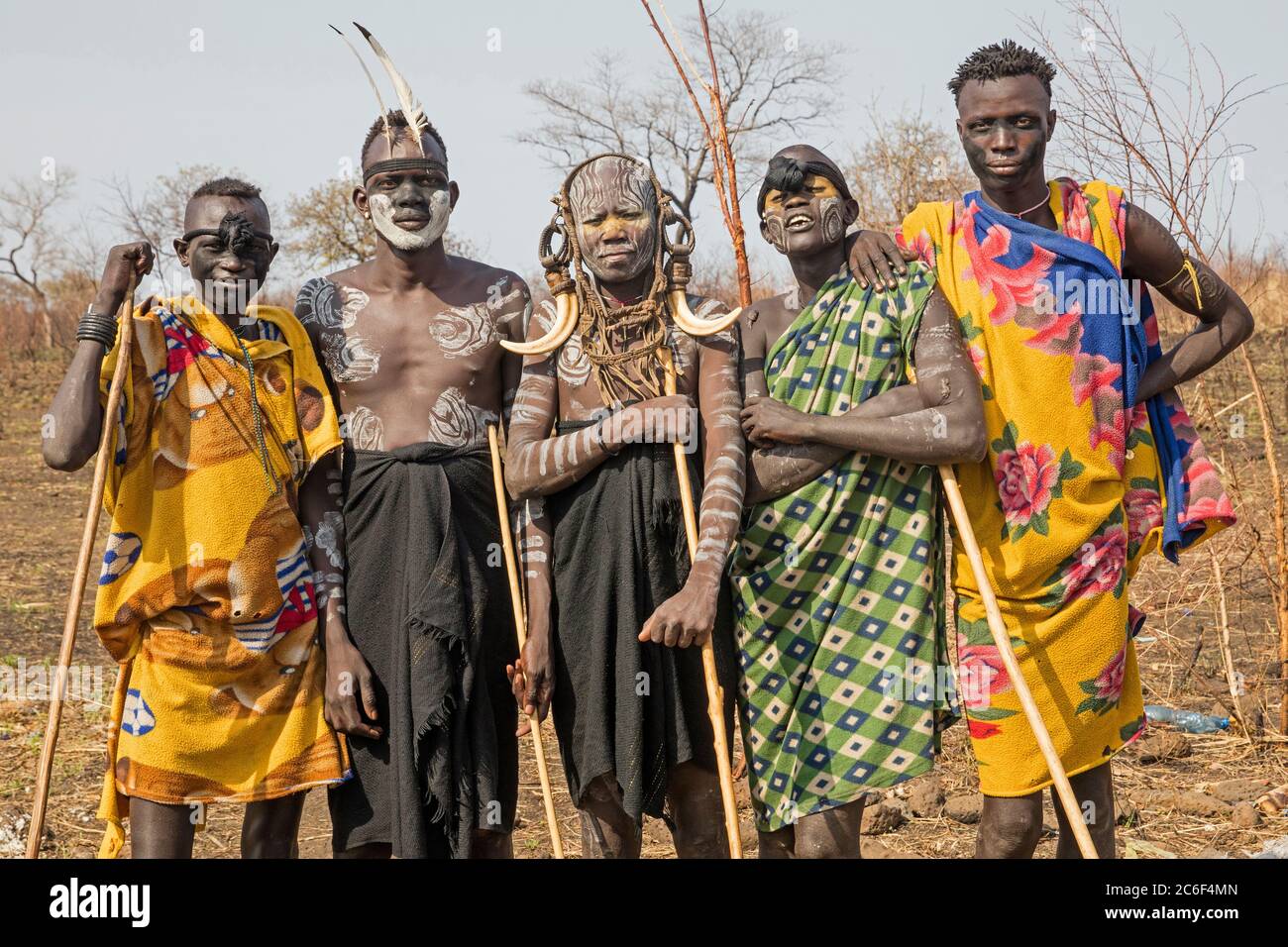 Painted and scarred warriors of the Mursi tribe in the Mago National Park near Jinka, Debub Omo Zone, Southern Ethiopia, Africa Stock Photo