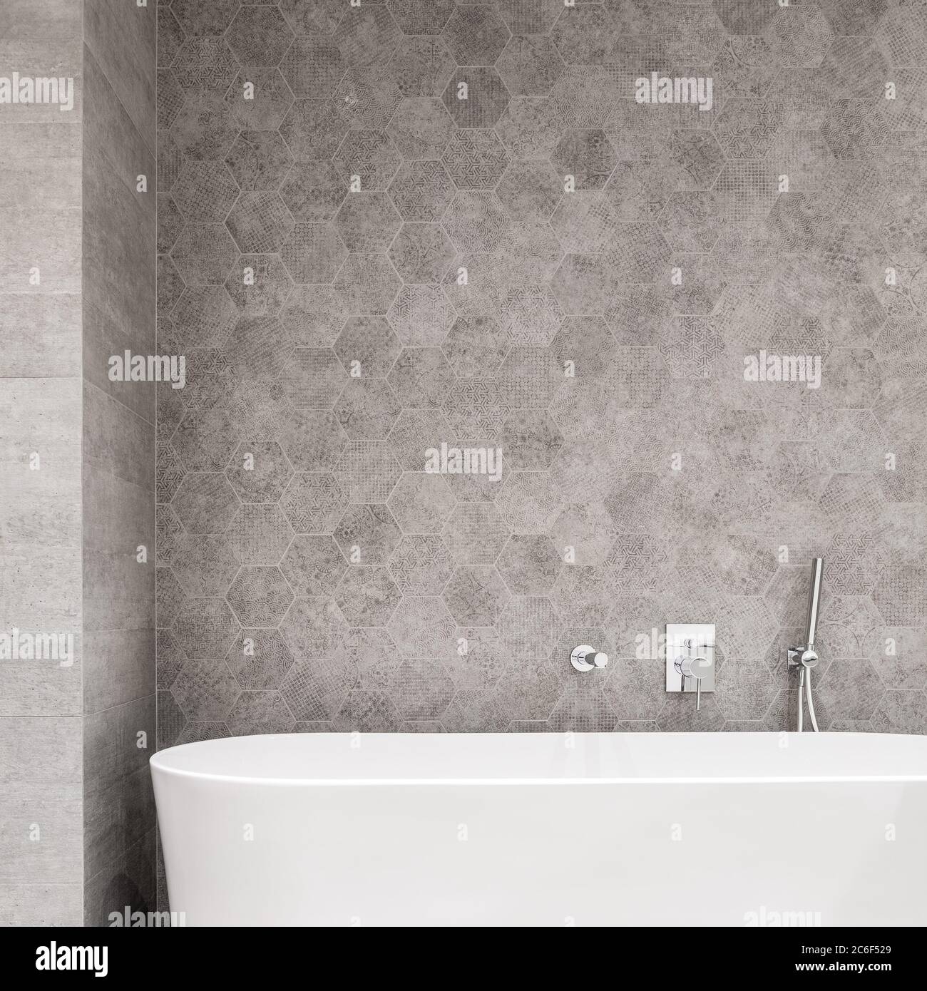Modern bathroom with elegant white bathtub and gray wall Stock Photo
